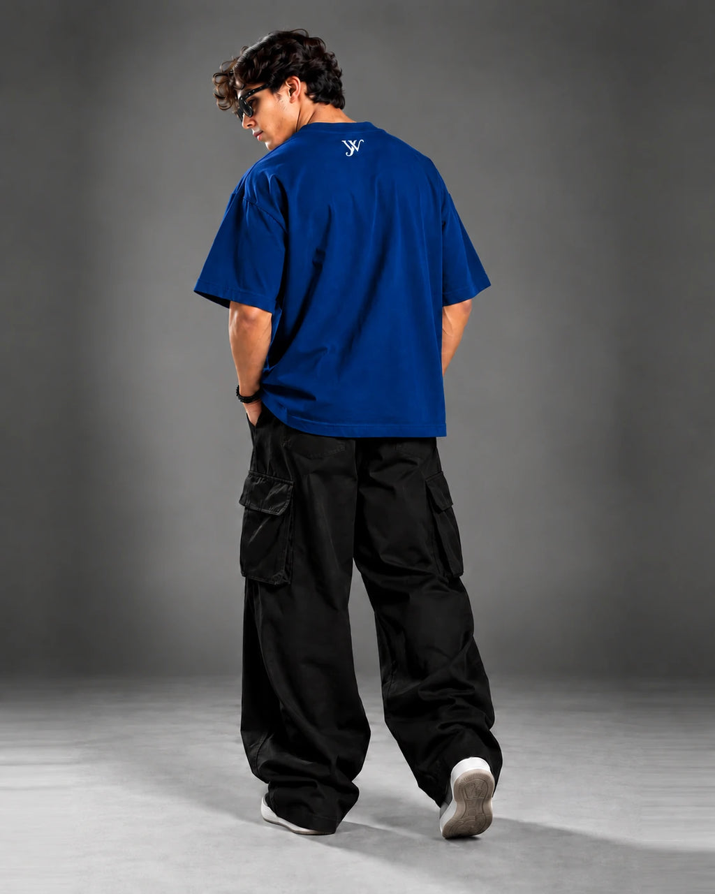 Model wearing the Navy Blue T-Shirt, back view showing the YW monogram print