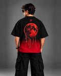 Crimson moon drip graphic close-up on the back of the Blood Moon Black Ombre Tee