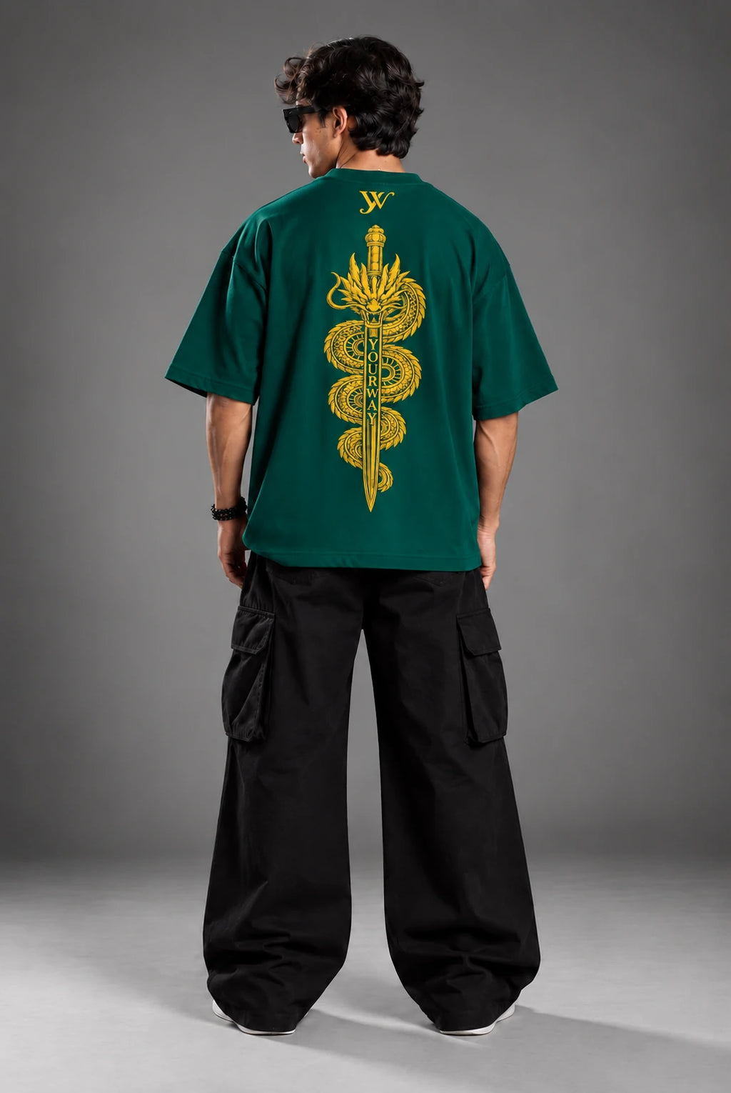 Lookbook shot of model wearing the Teal Dragon Sword T-Shirt with golden dragon and sword back graphic