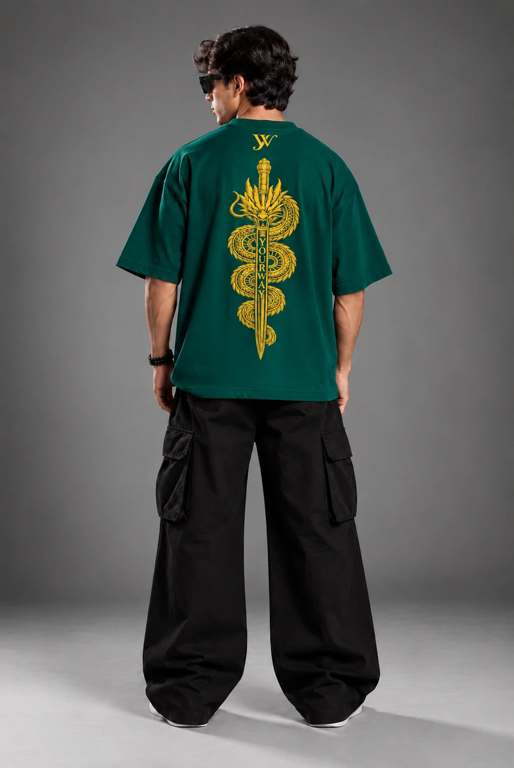 Lookbook shot of model wearing the Teal Dragon Sword T-Shirt with golden dragon and sword back graphic