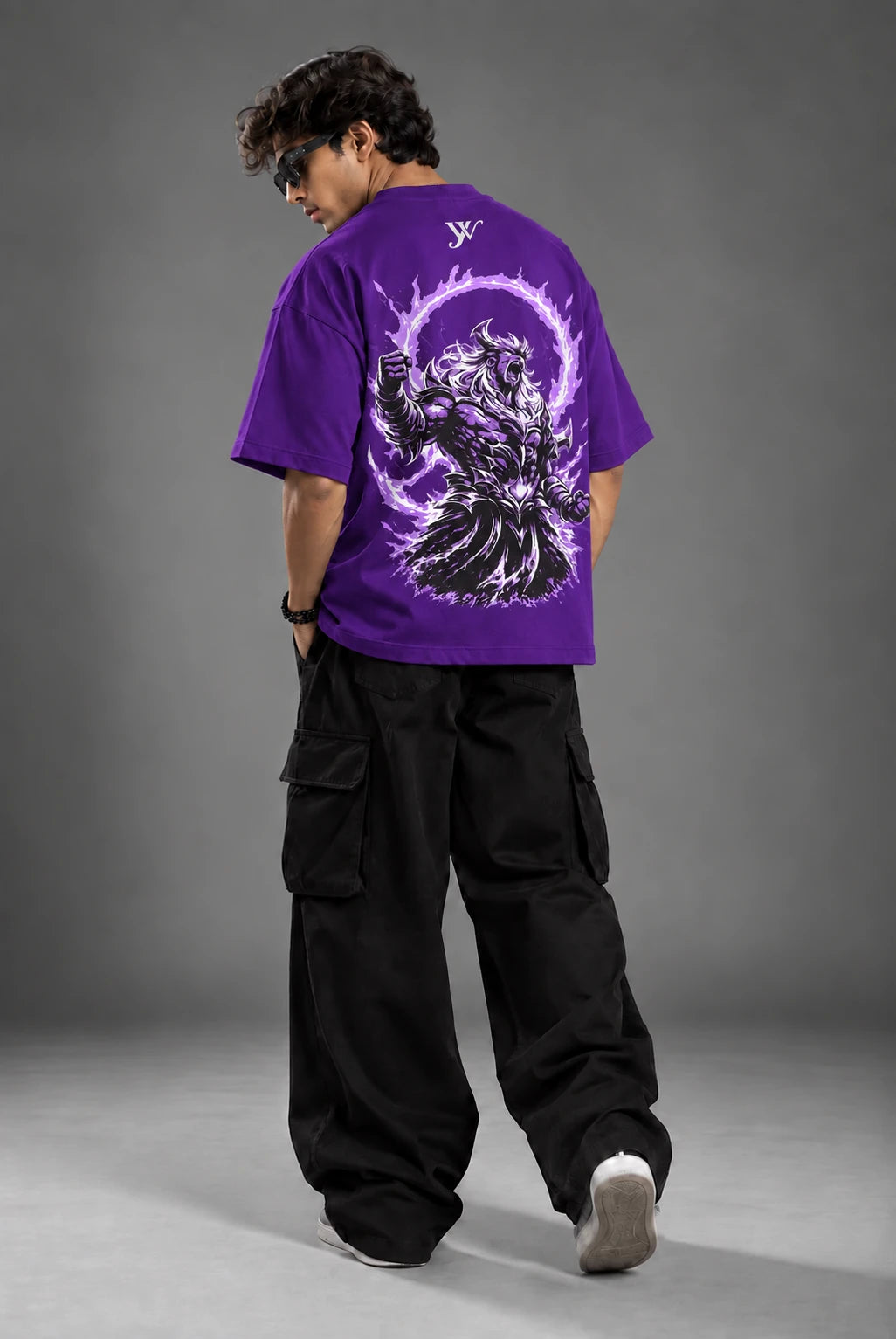 Model wearing Purple Warrior T-Shirt, back view paired with black cargo pants
