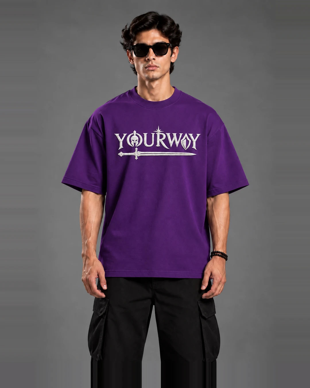 Close-up front view of Purple Warrior T-Shirt showing the embossed YOURWAY sword wordmark graphic