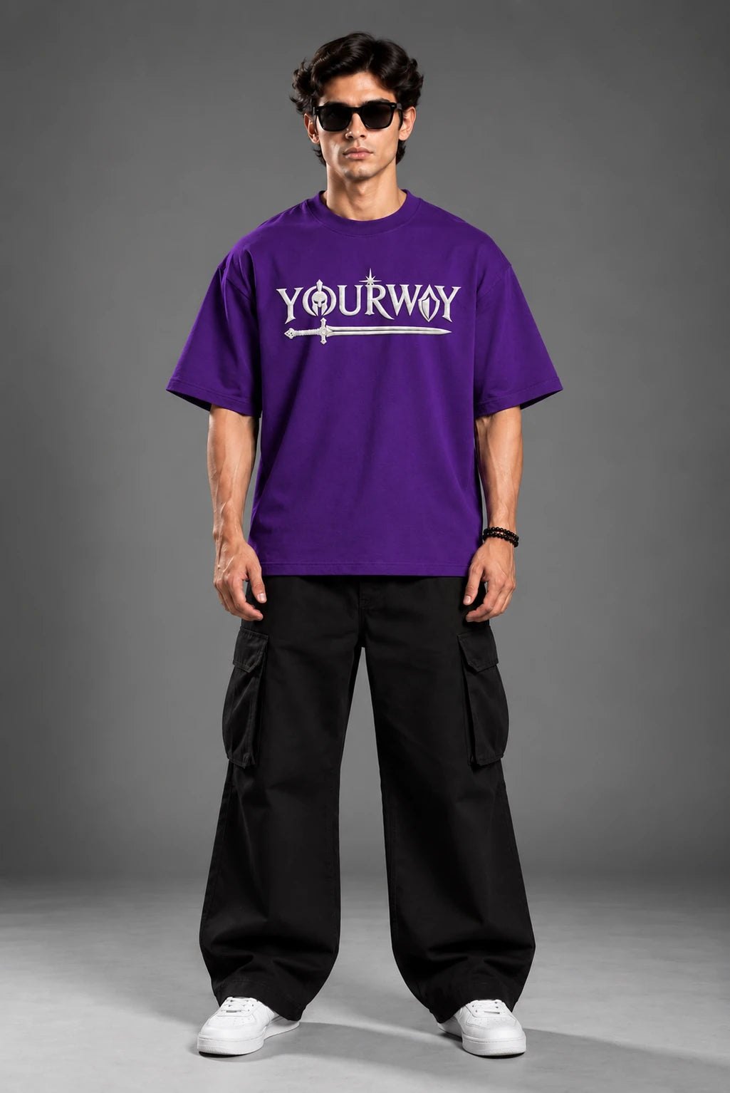 Studio portrait of model wearing Purple Warrior T-Shirt with embossed YOURWAY sword wordmark front print