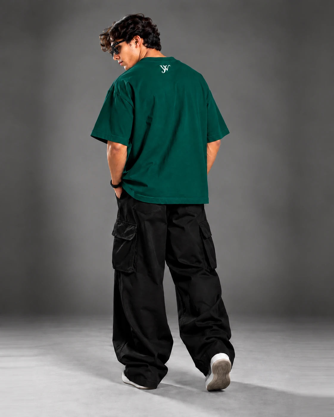 Model wearing the Emerald Green T-Shirt, back view showing the YW monogram print