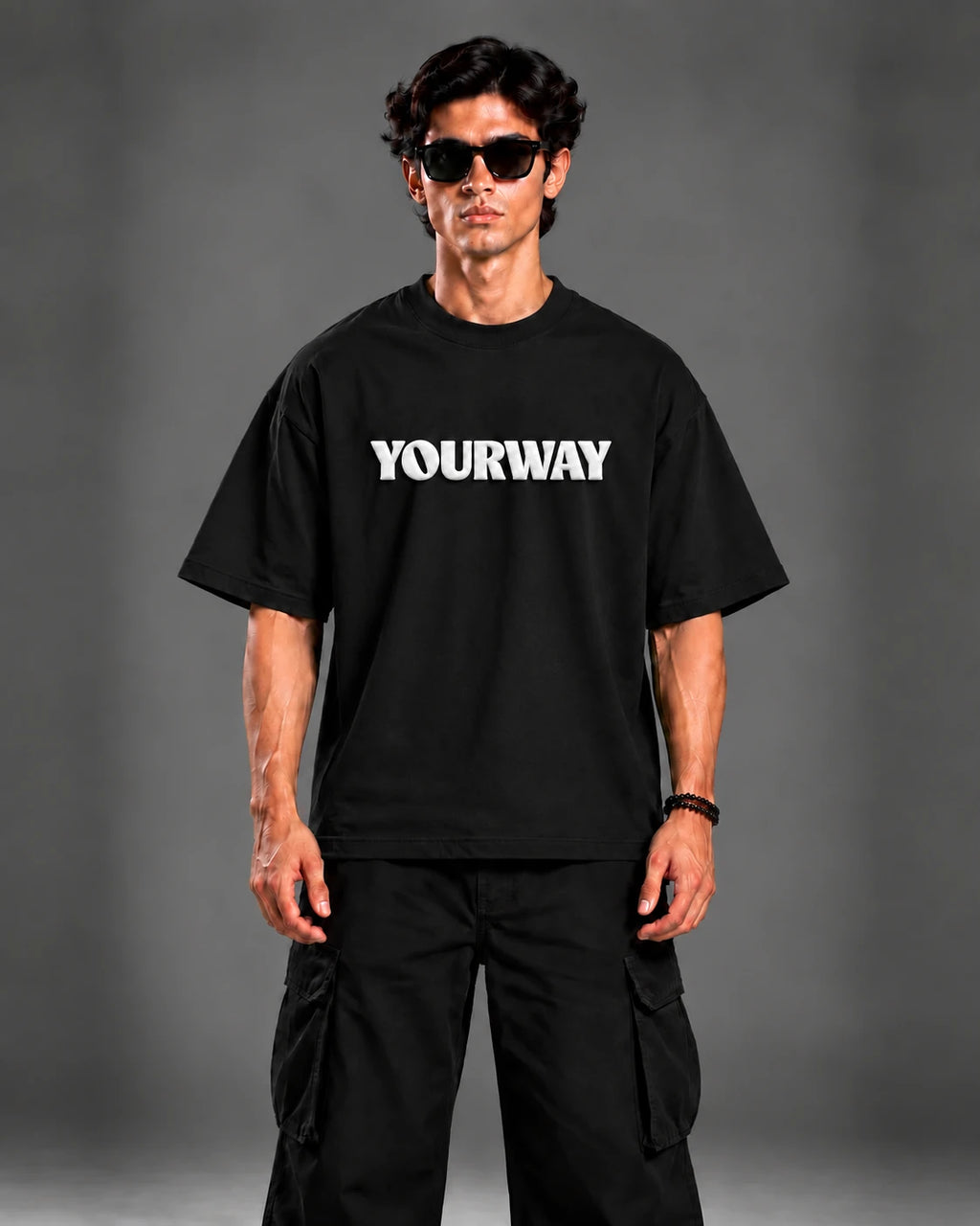 Model wearing the Black T-Shirt, back view walking pose with YW monogram print
