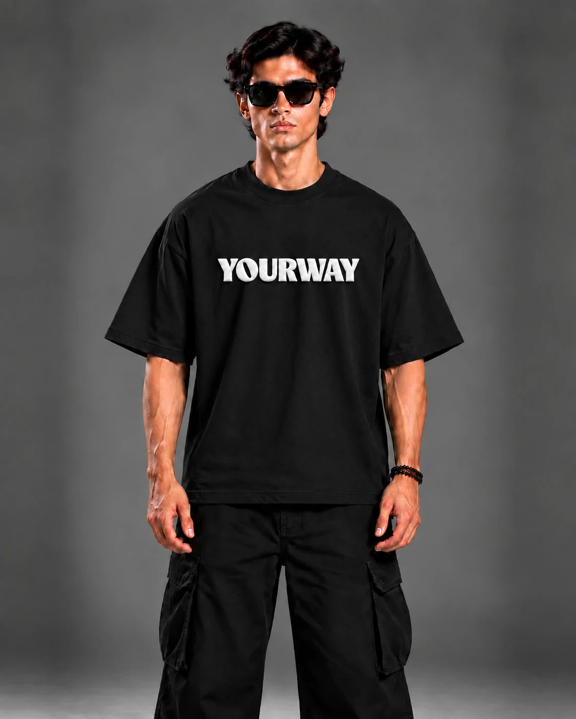 Model wearing the Black T-Shirt, back view walking pose with YW monogram print