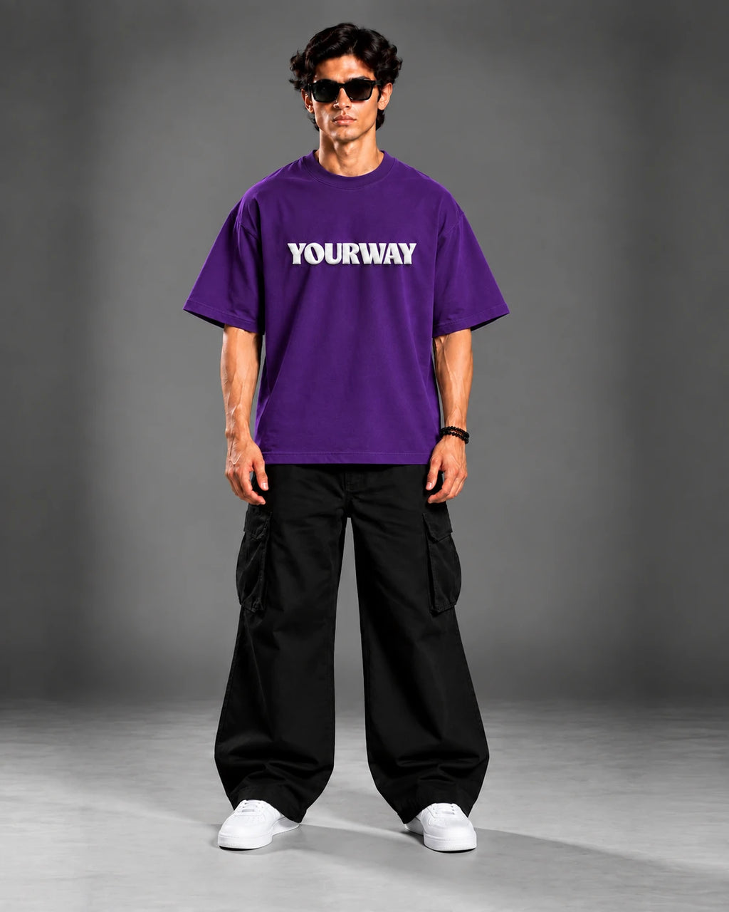 Model wearing the Royal Purple T-Shirt, back view walking pose with YW monogram print