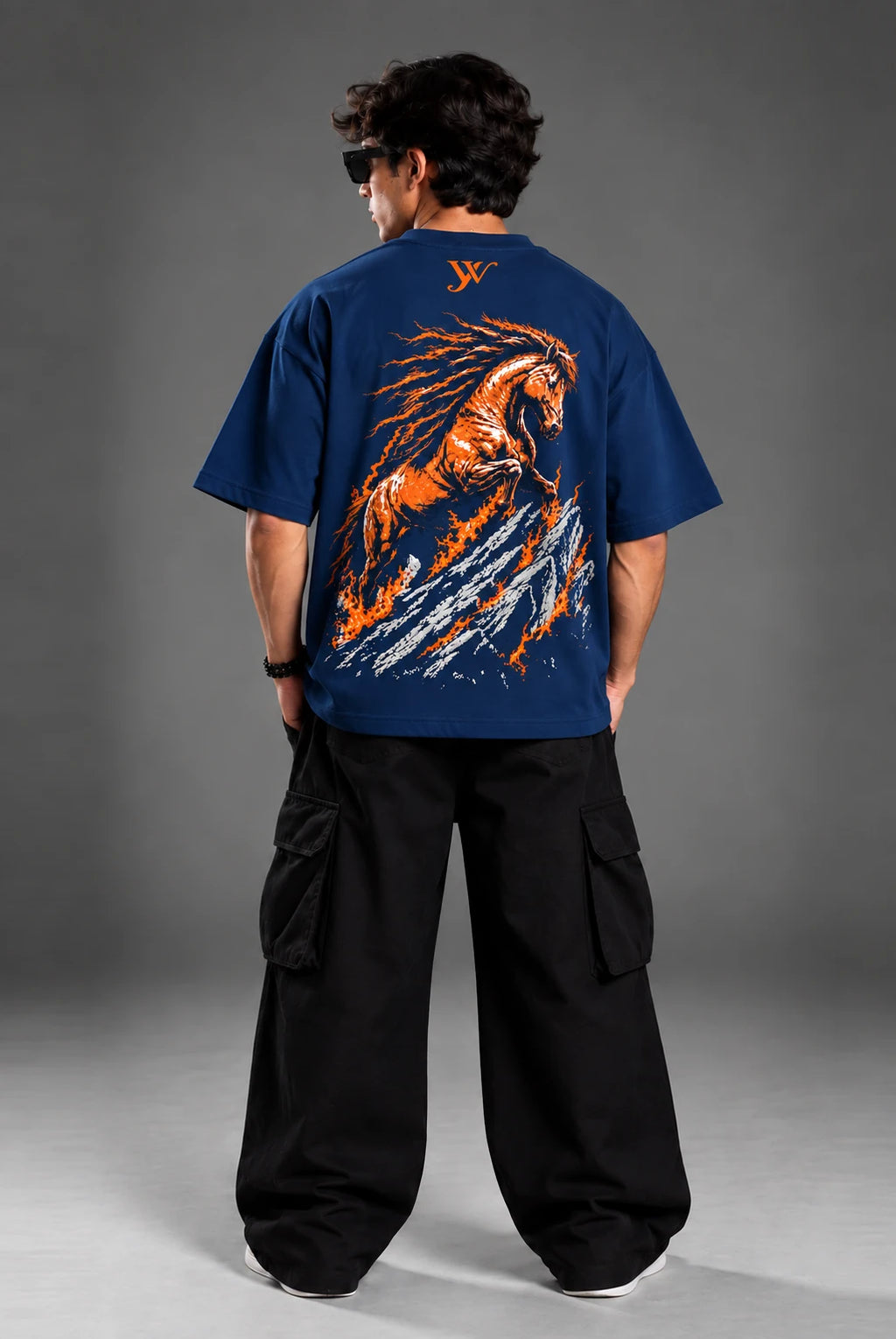 Studio portrait of model wearing the men's Navy Fire Horse T-Shirt with oversized drop-shoulder fit