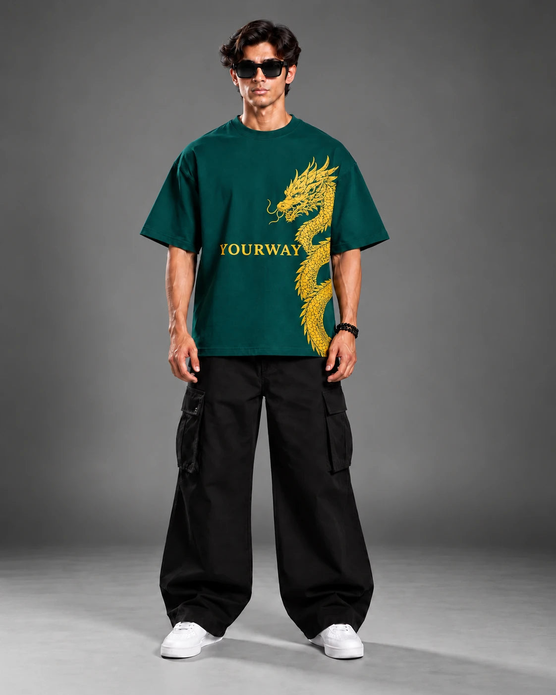 Model in teal YOURWAY t-shirt with gold dragon and sword graphic, front streetwear lookbook pose