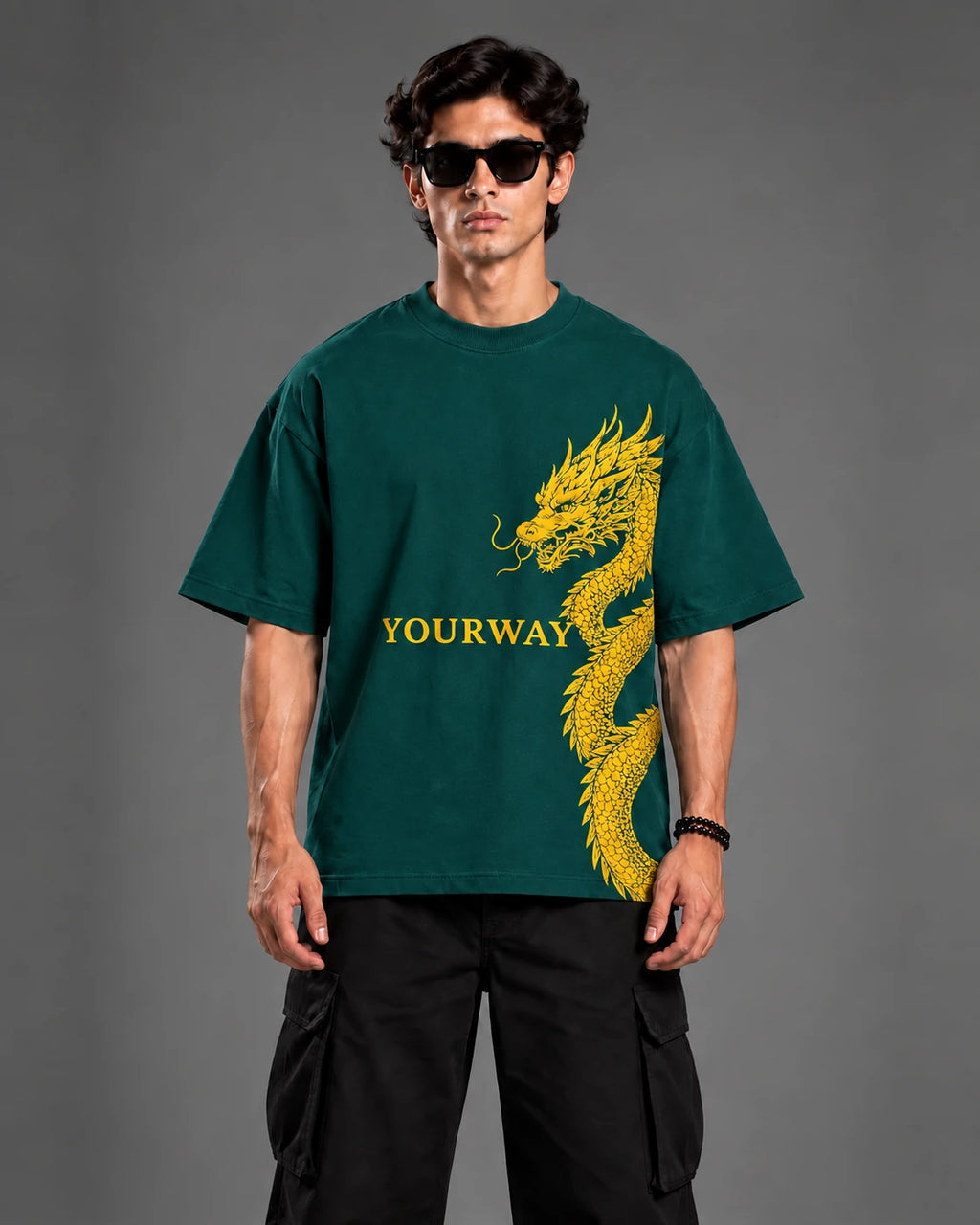 Front view of teal YOURWAY dragon and sword graphic t-shirt on model, streetwear studio portrait