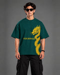Front view of teal YOURWAY dragon and sword graphic t-shirt on model, streetwear studio portrait
