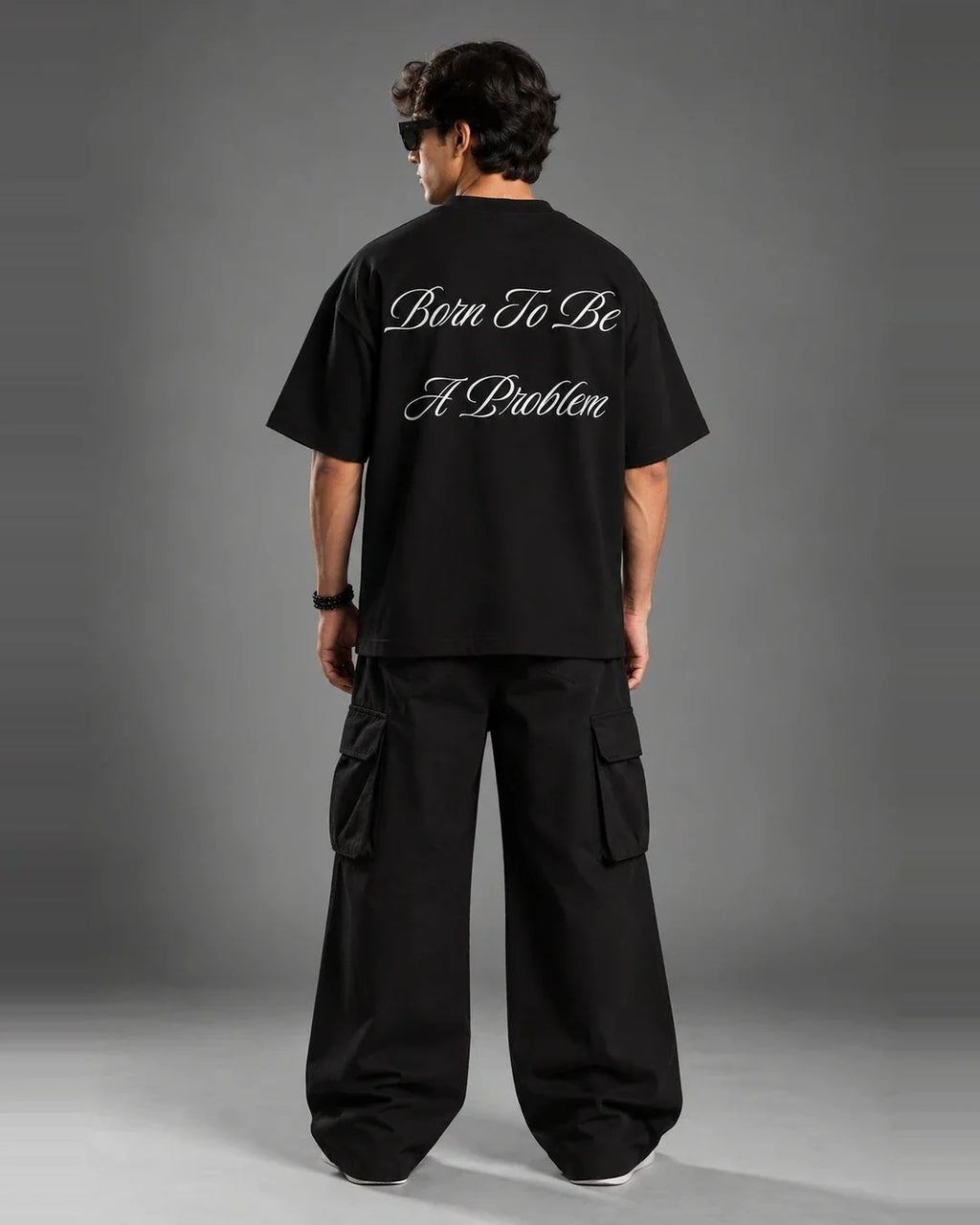 Born To Be A Problem black graphic tee back angled view