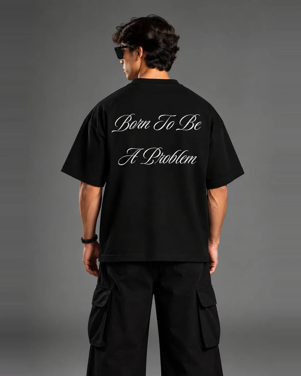 Born To Be A Problem t-shirt back view over shoulder