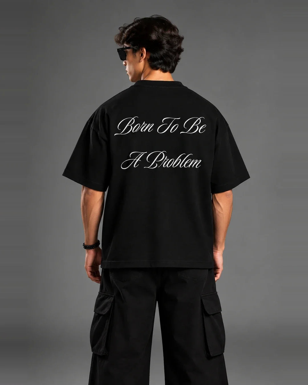 Born To Be A Problem t-shirt back view over shoulder